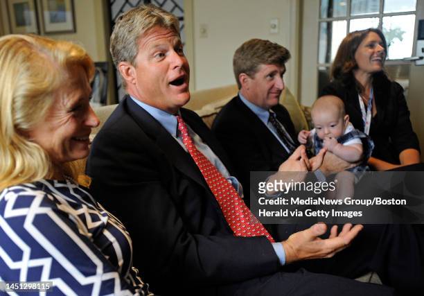 Anne "Kiki'" Kennedy, left, her husband, Ted Kennedy, Jr., Patrick Kennedy, his wife Amy and their four-month-old son Owen talk to the Boston Herald...