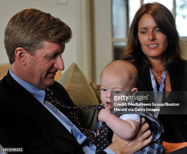 Patrick Kennedy, left, sits with his wife Amy as he holds their four-month-old son Owen at the Massachusetts delegation's hotel at the Democratic...