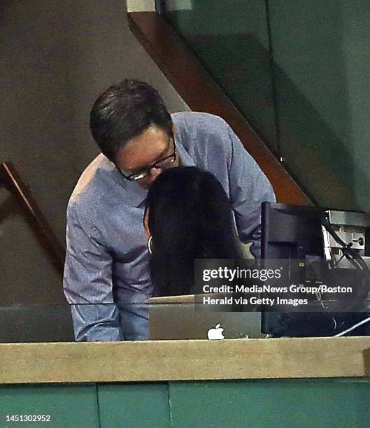 Red Sox owner John Henry kisses his wife Linda Pizzuti as the Red Sox take on the White Sox at Fenway. Friday, August 30, 2013.