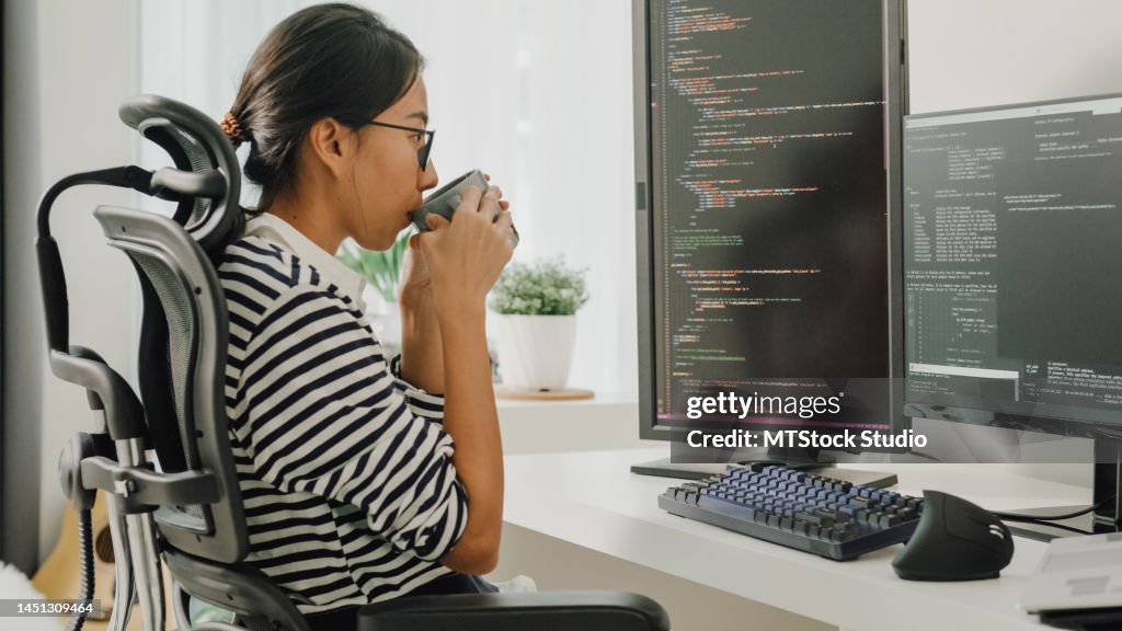 Software Woman Young Asian Woman Software Developers Drinking Coffee And Using ...