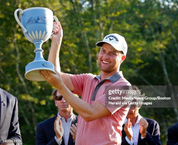 Chris Kirk hoists the trophy after winning the final round of the Deutsche Bank Championship at TPC Boston in Norton on Monday, September 1, 2014....