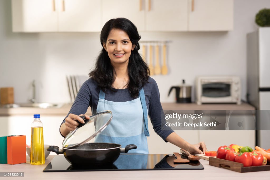 Woman in the kitchen stock photo