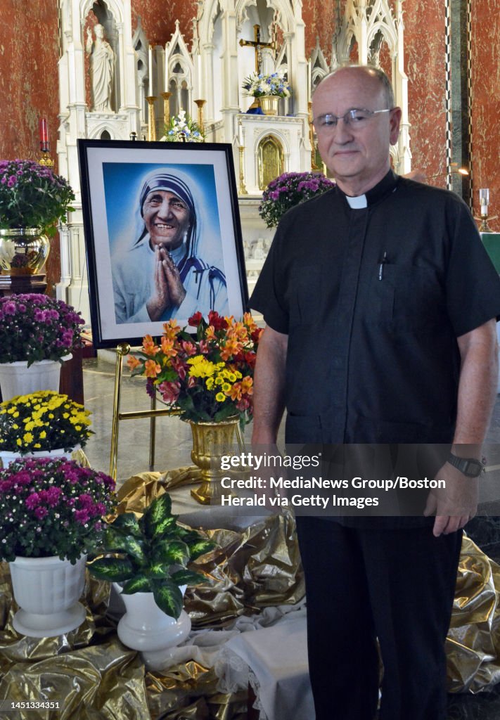 Fr Ralph Powell Father Robert Powell stands by a portrait Mother Teresa in Saint ...