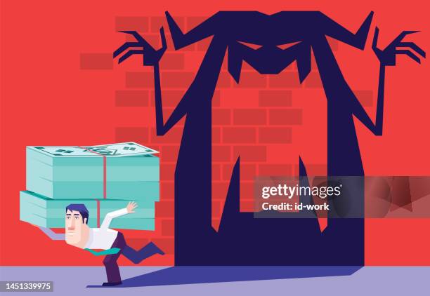businessman carrying stack of money banknotes and running with monster shadow following - evil banker stock illustrations
