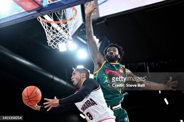 Rashard Kelly of the Jackjumpers blocks the shot of Peyton Siva of the Hawks during the round 12 NBL match between Tasmania Jackjumpers and Illawarra...