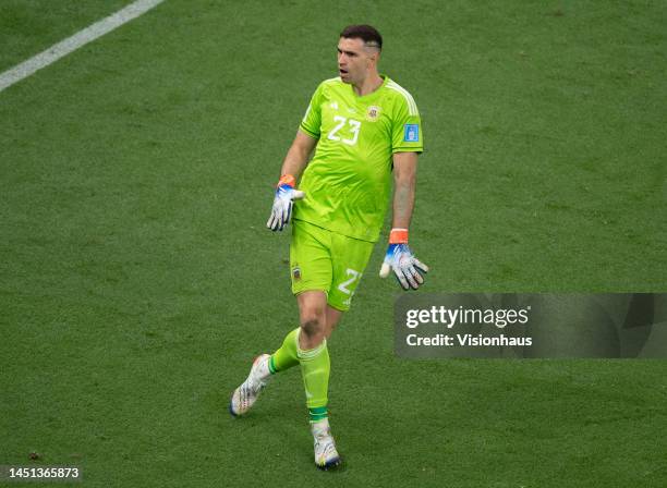 Damian Martinez of Argentina dances in celebration during the penalty shoot-out during the FIFA World Cup Qatar 2022 Final match between Argentina...