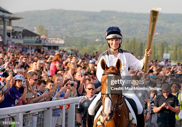 Olympic Torchbearer Zara Phillips carries the Olympic Flame whilst riding her horse Toytown on day 5 of the 70 day Olympic Torch Relay tour of the UK...