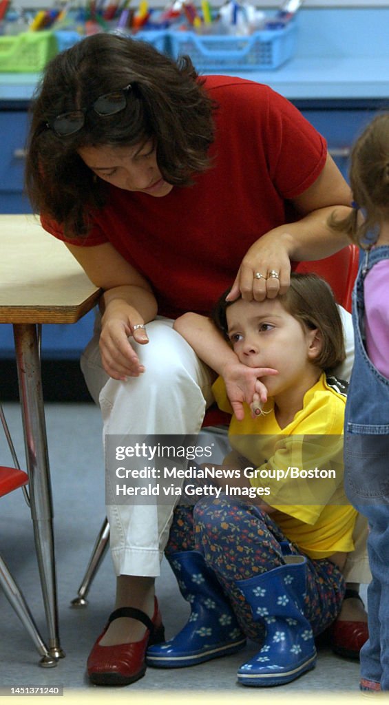 Rubi Simon of Dorchester consoles her daughter Nathalie who will be
