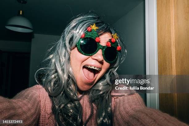 young happy girl selfie celebrating christmas - ethnic woman at christmas stock pictures, royalty-free photos & images