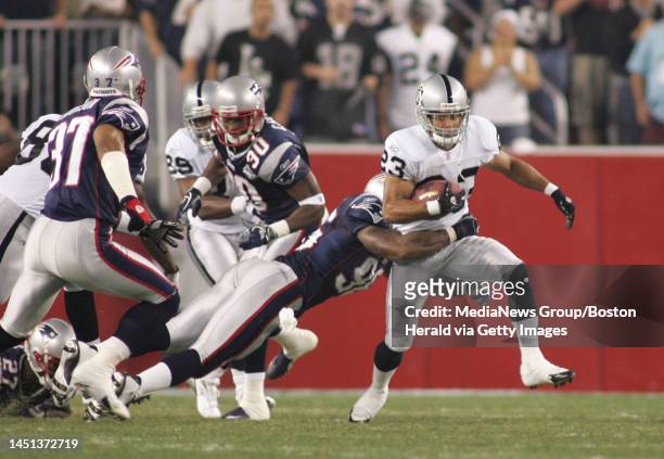 New England Patriots kick off the 2005 season in grand fashion vs. Oakland Raiders at Gillette Stadium. Oakland's Chris Carr tries to break the...