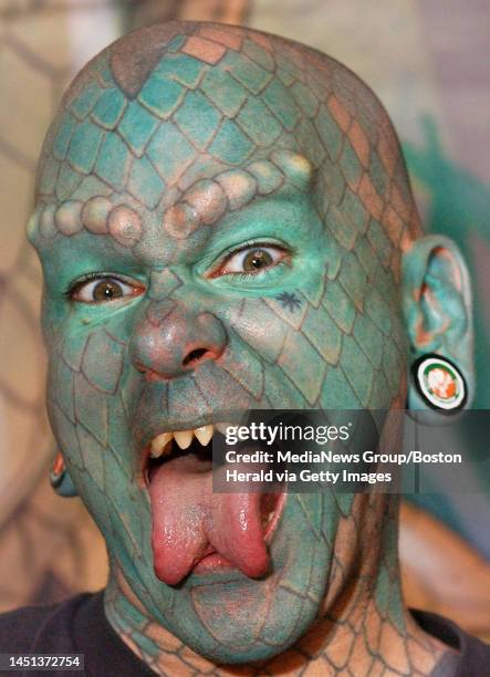 Performance artist "Lizardman" proudly displays his full facial tattoo's and custom dentle work inside the convention.Staff Photo by Patrick...