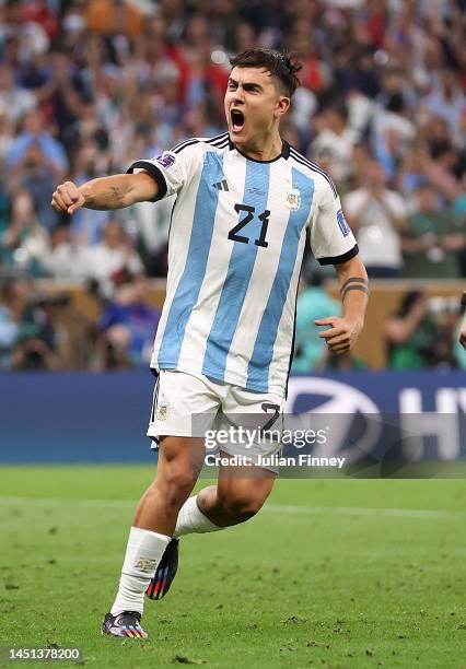 Paulo Dybala of Argentina celebrates converting his penalty during the FIFA World Cup Qatar 2022 Final match between Argentina and France at Lusail...