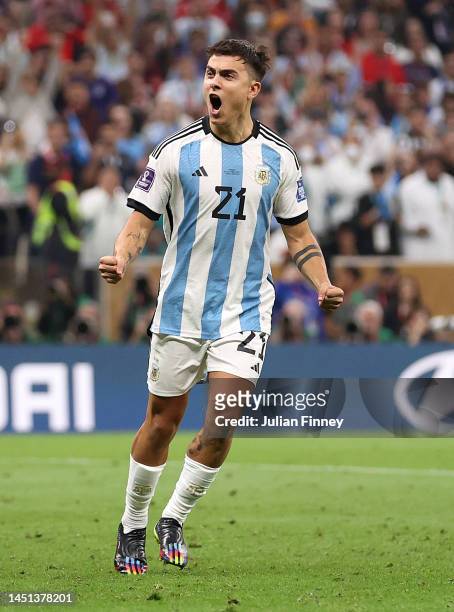 Paulo Dybala of Argentina celebrates converting his penalty during the FIFA World Cup Qatar 2022 Final match between Argentina and France at Lusail...