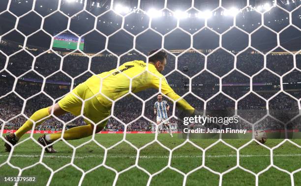 Lionel Messi of Argentina scores the team's first penalty past Hugo Lloris of France in the penalty shoot out during the FIFA World Cup Qatar 2022...