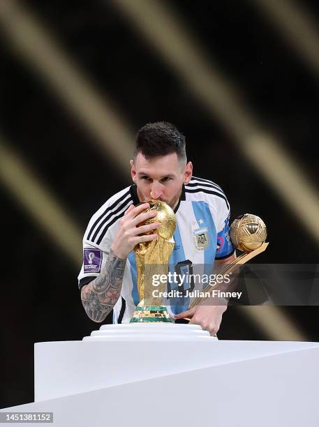 Lionel Messi of Argentina kisses the FIFA World Cup Qatar 2022 Winner's Trophy during the FIFA World Cup Qatar 2022 Final match between Argentina and...