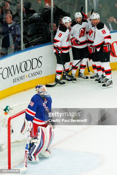 Travis Zajac celebrates his first period goal with Zach Parise, Marek Zidlicky, and Dainius Zubrus of the New Jersey Devils as Henrik Lundqvist of...