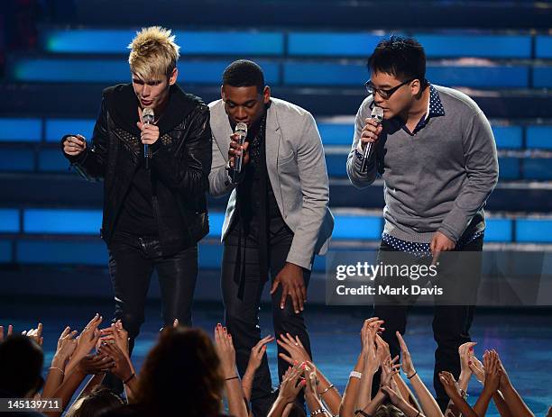 Singers Colton Dixon, Joshua Ledet, and Heejun Han perform onstage during Fox's "American Idol 2012" results show at Nokia Theatre L.A. Live on May...