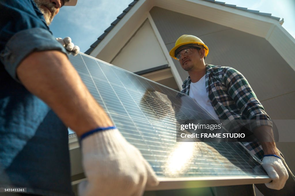Workers, contractors, engineers in plaid shirts and yellow hard hats carry toolboxes. Inside the house that is being constructed, renovated, renovated by a professional technician who is ready to repair and improve And build a house according to the needs