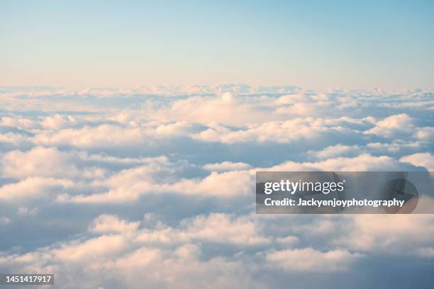 high angle view from the aircraft - clouds sky stock-fotos und bilder