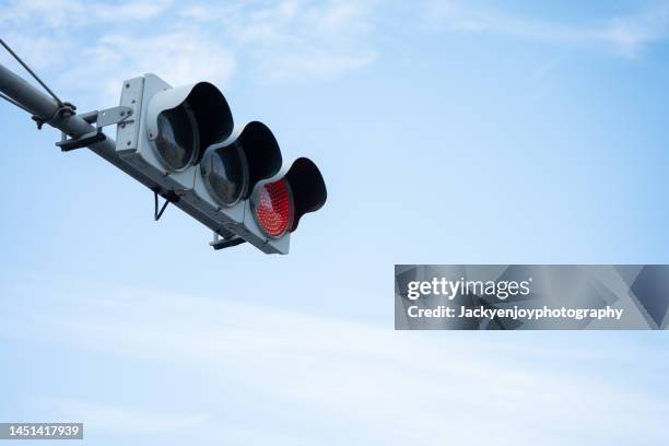 low angle view of road sign against blue sky - sinal rodoviário imagens e fotografias de stock