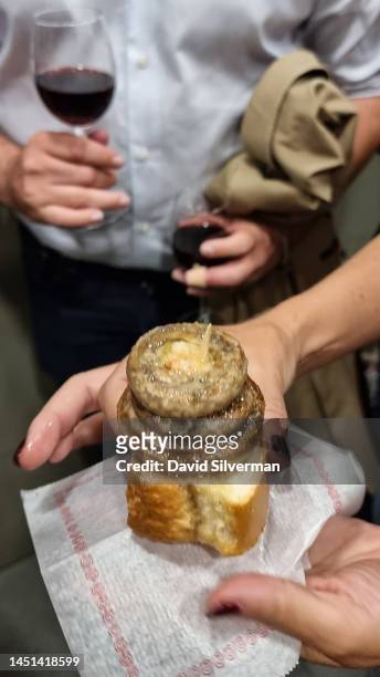 Customers eat grilled mushrooms at Bar Soriano, an iconic pinchos eatery on Calle del Laural on September 8, 2022 in Logrono, the capital of the...