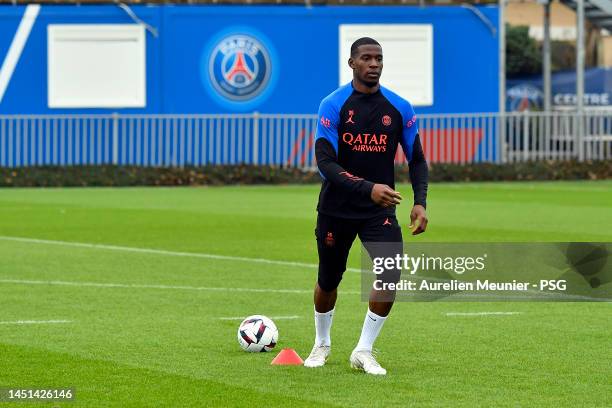 Nordi Mukiele runs with the ball during a Paris Saint-Germain training session at PSG training center on December 22, 2022 in Paris, France.