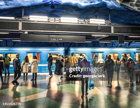 Passengers waiting to board subway train