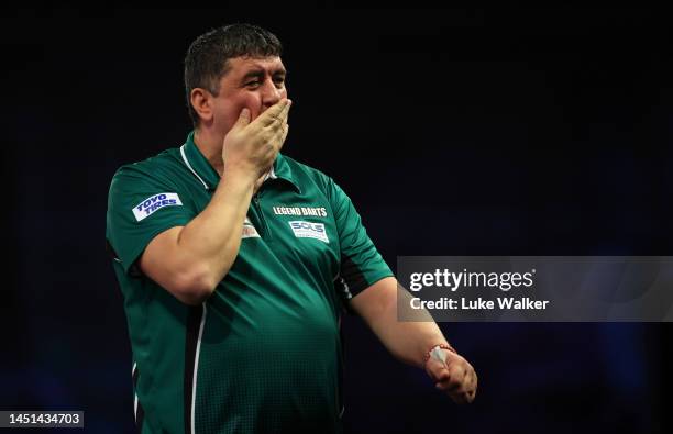 Mensur Suljović of Serbia celebrates the win during his Round Two Match against Mike De Decker of Belgium During Day Eight of The Cazoo World Darts...