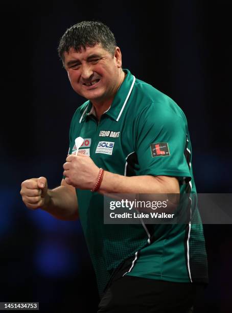 Mensur Suljović of Serbia celebrates the win during his Round Two Match against Mike De Decker of Belgium During Day Eight of The Cazoo World Darts...