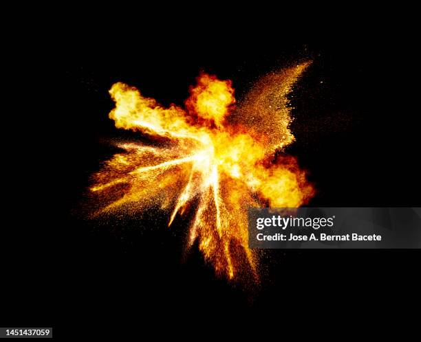 full frame of a smoke and fire explosion on a black background - exploding stock pictures, royalty-free photos & images