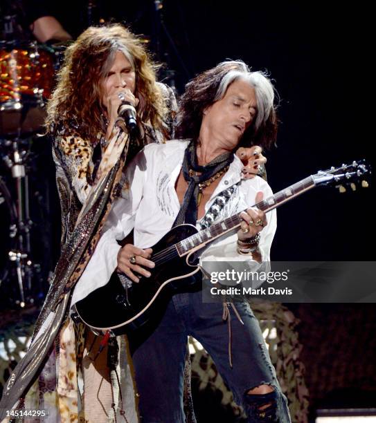 Singer Steven Tyler and musician Joe Perry of Aerosmith perform onstage during Fox's "American Idol 2012" results show at Nokia Theatre L.A. Live on...