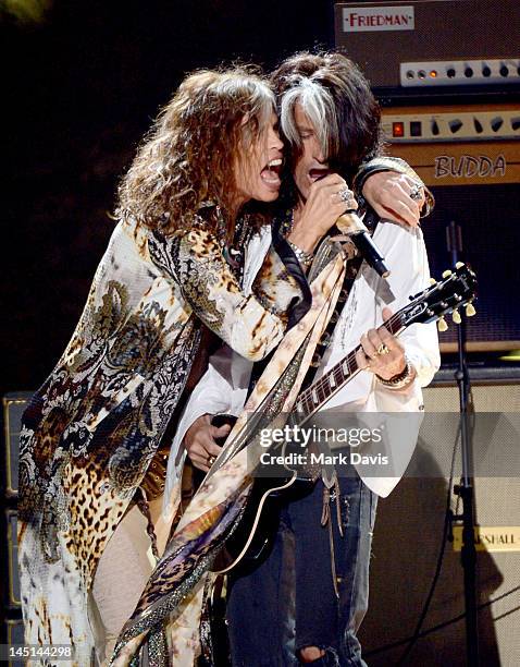 Singer Steven Tyler and musician Joe Perry of Aerosmith perform onstage during Fox's "American Idol 2012" results show at Nokia Theatre L.A. Live on...