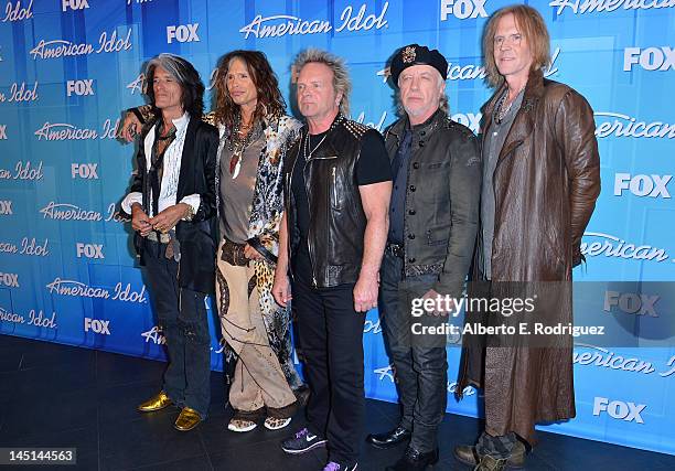 Musicians Joe Perry, Steven Tyler, Joey Kramer, Brad Whitford, and Tom Hamilton pose in the press room during Fox's "American Idol 2012" Finale...