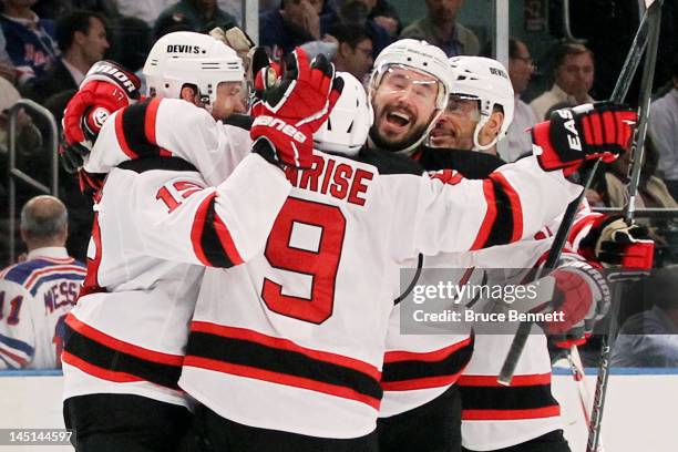 Zach Parise, Travis Zajac, Ilya Kovalchuk and Bryce Salvador of the New Jersey Devils celebrate their 5 to3 win over the New York Rangers in Game...