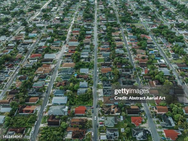 aerial image showing rows of houses in a suburb of nassau, new providence, bahamas - nassau aerial stock pictures, royalty-free photos & images