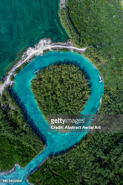 sea channel on rose island photographed from directly above, bahamas - atoll stock pictures, royalty-free photos & images