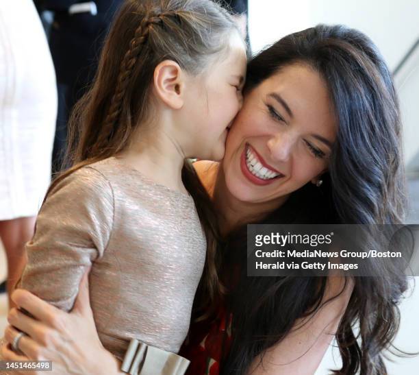 Linda Pizzuti Henry gets a kiss from her daughter, Sienna, during the From Fenway to the Runway fashion show & luncheon, Monday, September 12, 2016....