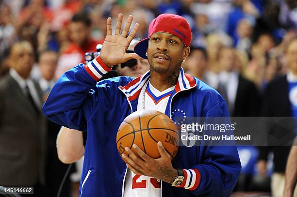 Former Philadelphia 76ers player Allen Iverson walks onto the court to deliver the game ball before the game against the Boston Celtics in Game Six...