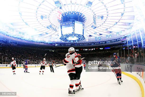 Ryan Carter of the New Jersey Devils celebrates his third period goal with Stephen Gionta in Game Five of the Eastern Conference Final against the...