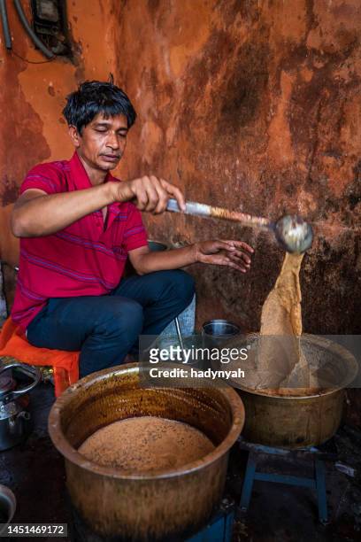 indian street seller selling tea - masala chai in jaipur - chai tea stock pictures, royalty-free photos & images