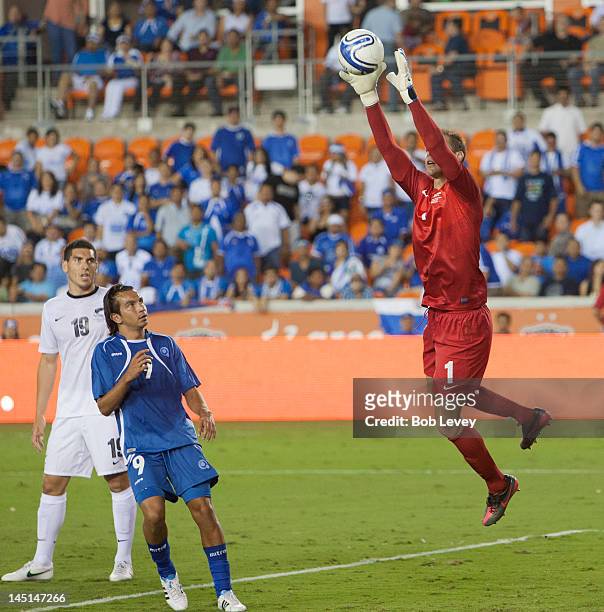 Goalkeeper Mark Paston of New Zealand makes a save in front of Rafael Edgardo Burgos of El Salvador at BBVA Compass Stadium on May 23, 2012 in...