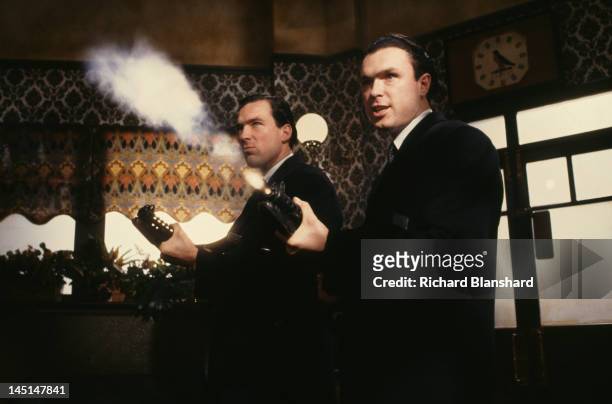 Martin Kemp and his brother Gary as British gangsters Reggie and Ronnie Kray, respectively in a scene from 'The Krays', directed by Peter Medak, 1990.
