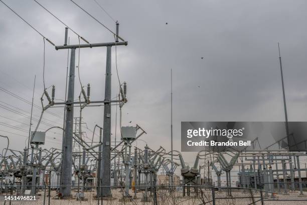 Transmission towers at a powerplant near the Energy Research Park facility on December 22, 2022 in Houston, Texas. Gov. Greg Abbott and state...