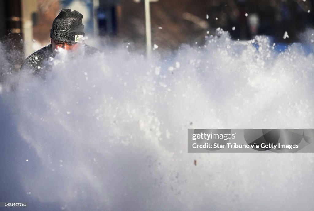 Minnesota December Javier Galicia was immersed in his work, clearing snow from a... News ...