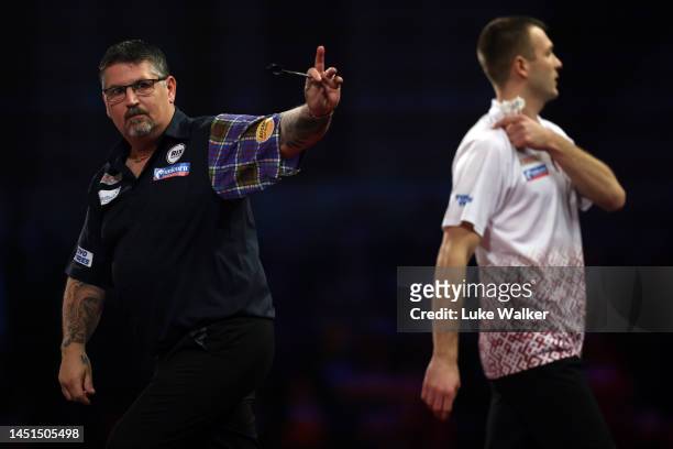 Gary Anderson of Scotland reacts during his Round Two Match against Madars Razma of Lativa During Day Eight of The Cazoo World Darts Championship at...