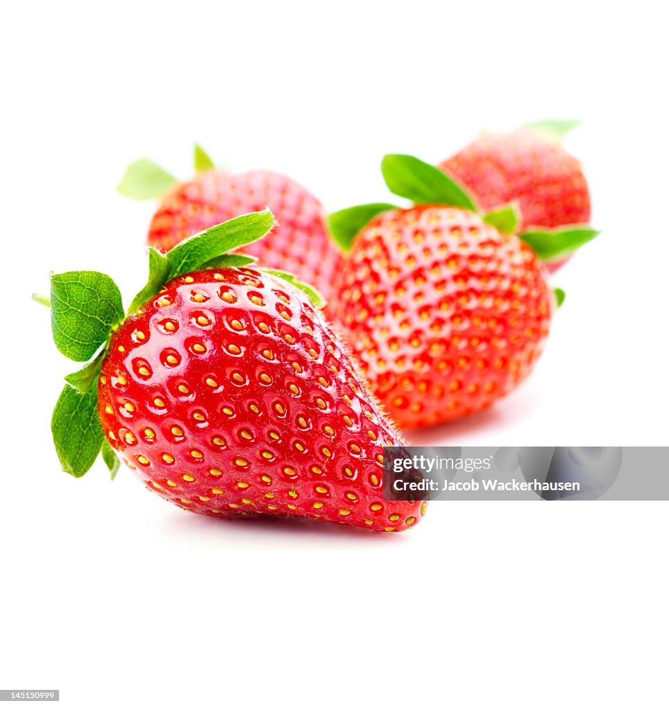 Close-up of strawberries on white background