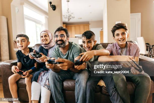 the best ways to help kids financially - arab people stock pictures, royalty-free photos & images