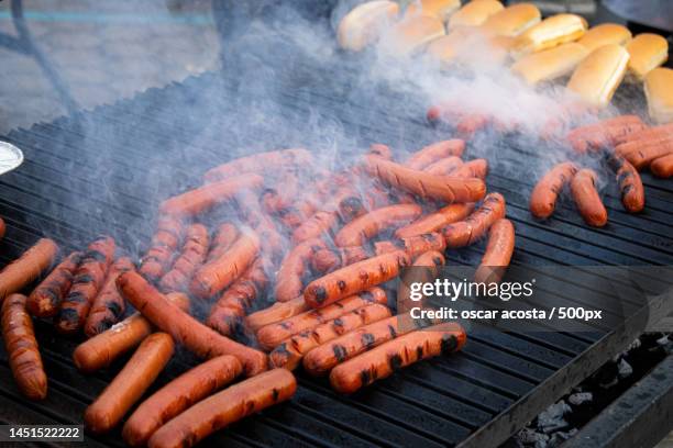 high angle view of meat on barbecue grill - grill fire meat stockfoto's en -beelden