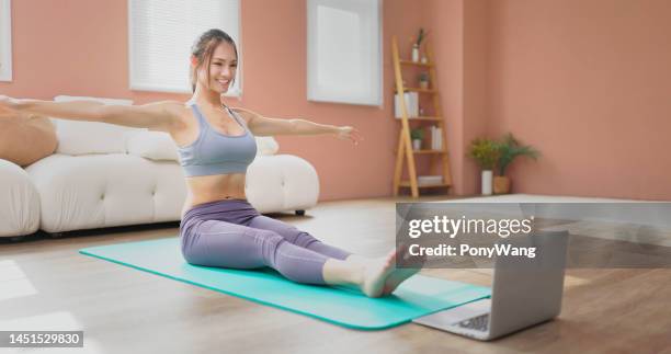 woman doing yoga - slow internet stock pictures, royalty-free photos & images