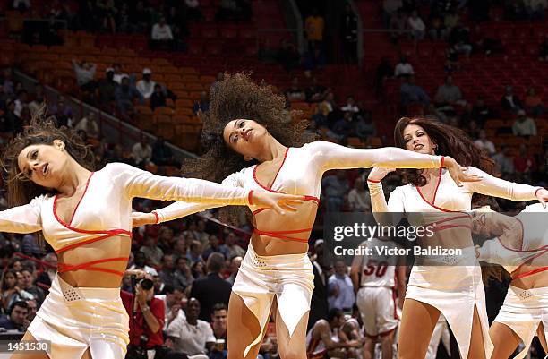 The Miami Heat Dancers do their part for the team against the Portland Trail Blazers in the first half at American Airlines Arena in Miami, Florida....